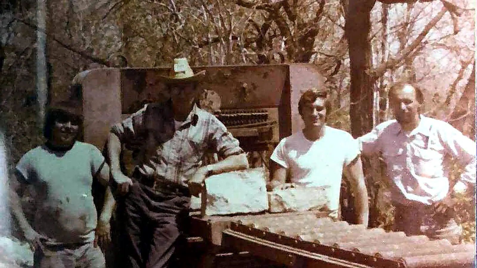 An early Pyle Bros. crew at a stone-splitting machine, photographed decades ago.