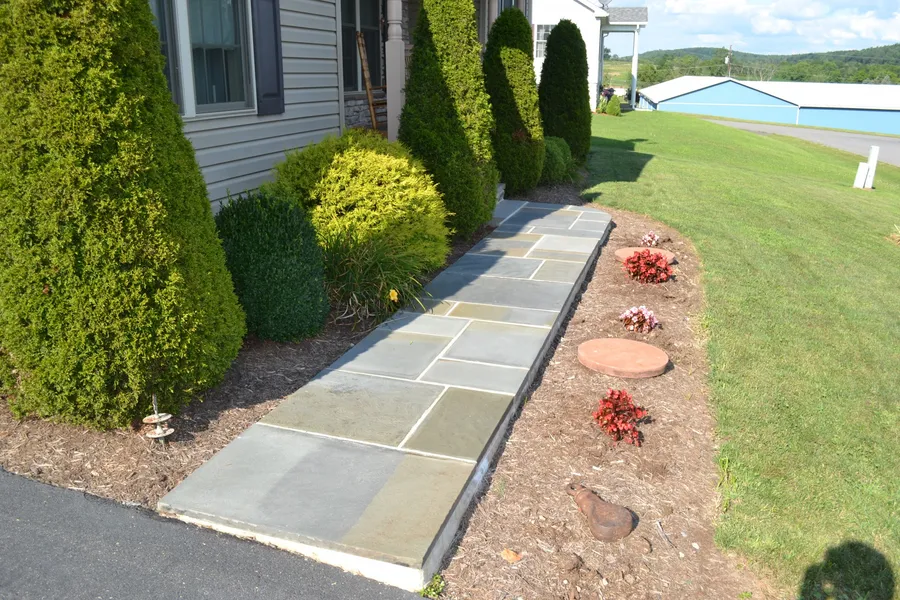 A flagstone walkway installed by Pyle Bros.